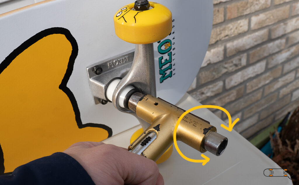 adjusting skateboard trucks with a tool